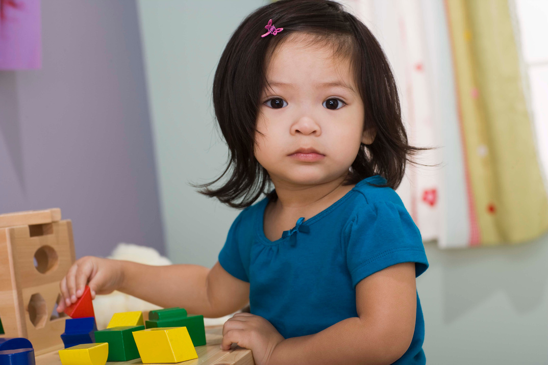 Toddler playing with blocks