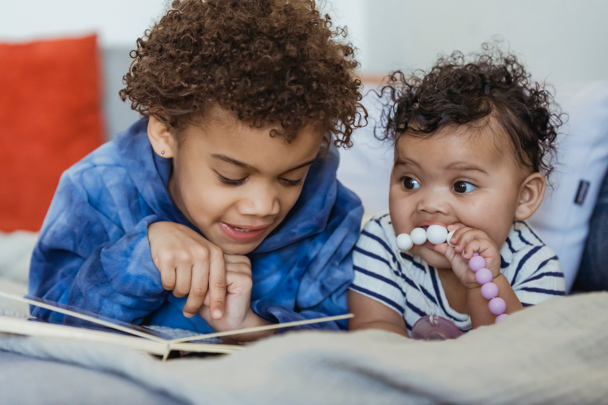 Black children lying on couch